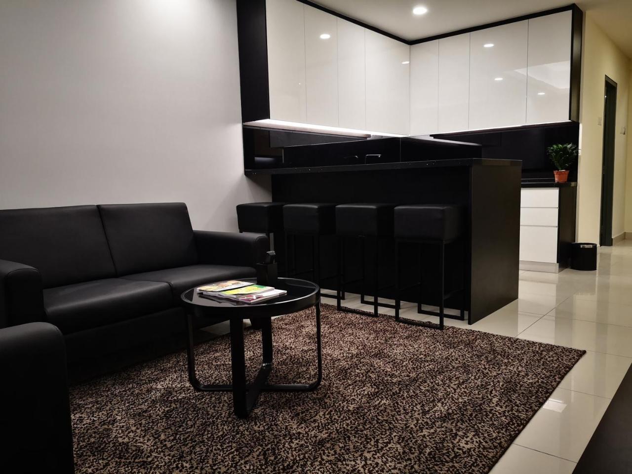 Gloria Residences Ion Delemen Genting Highlands Exterior foto A living room with a carpet
